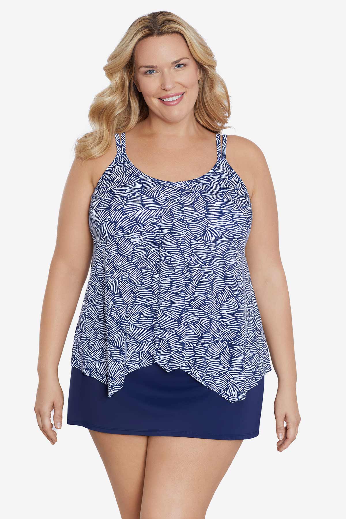 Woman wearing a blue and white abstract pattern tankini top