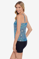 Woman turned left wearing a blue tile pattern side ring tankini top