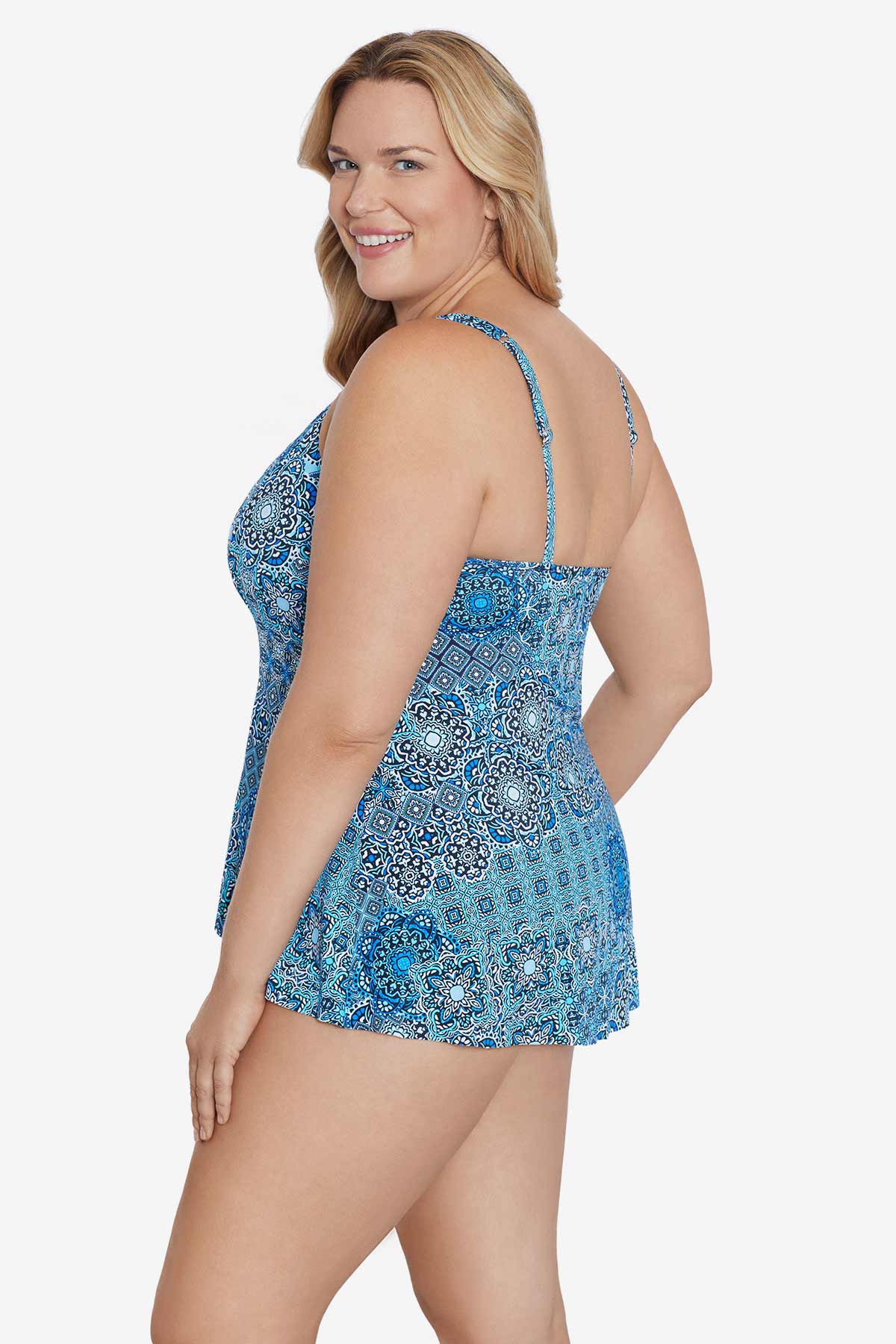 Woman turned left wearing a blue tile pattern tankini top