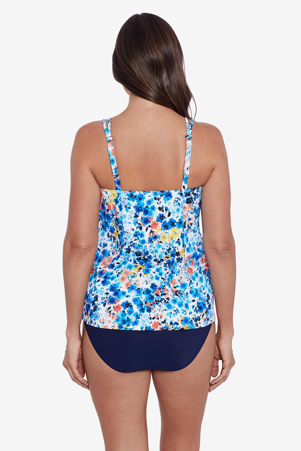 Woman faced away wearing a multicolored small floral printed tankini top