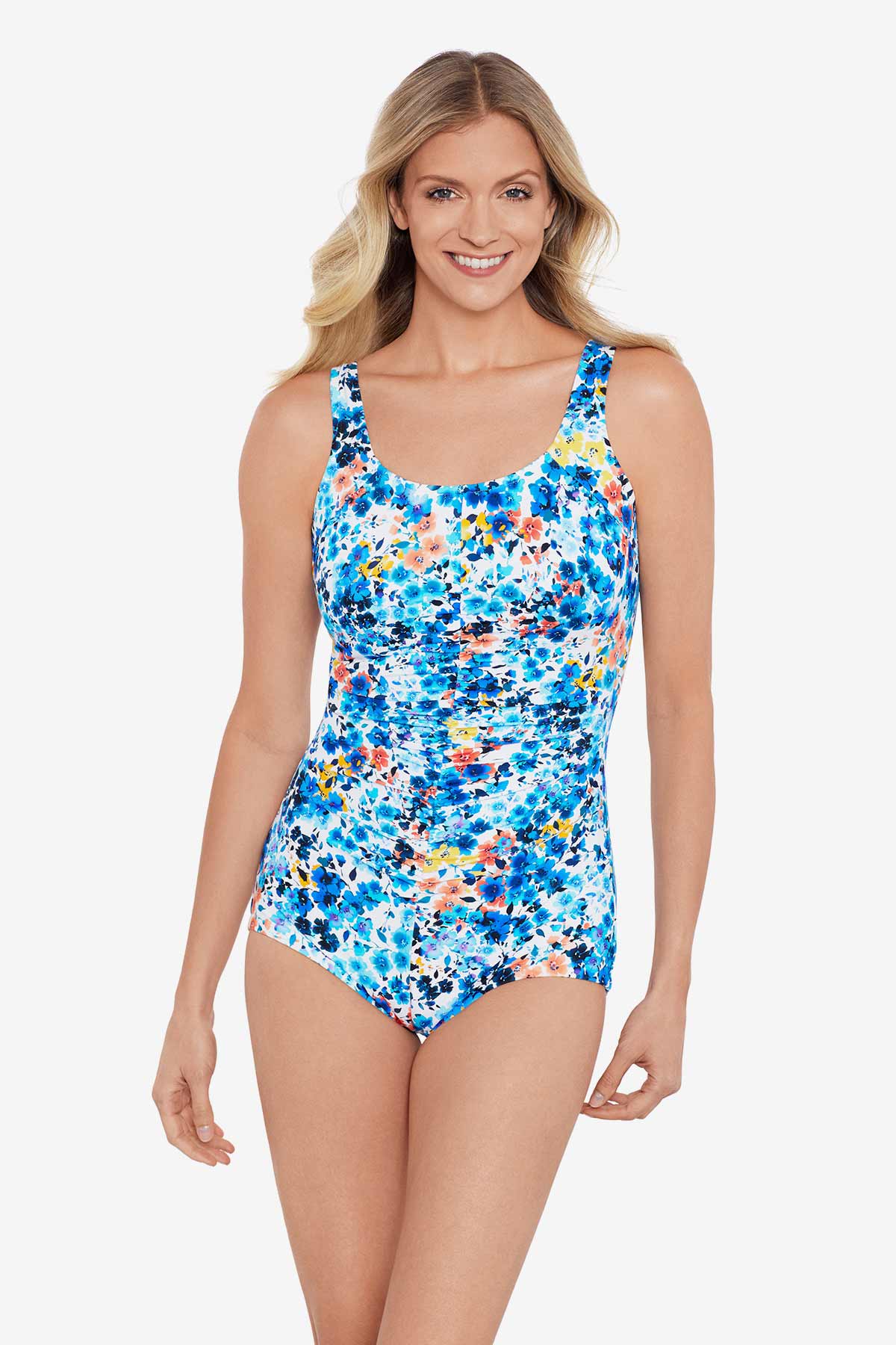 Woman wearing a multicolored floral printed one-piece swimsuit
