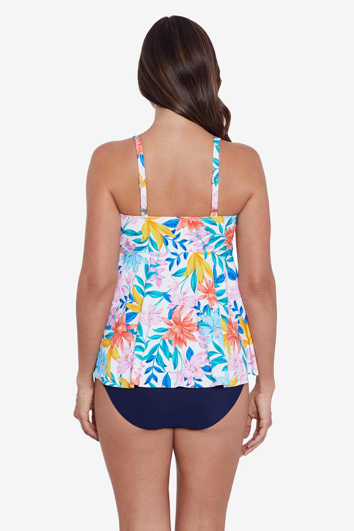 Woman faced away wearing a multicolored tropical print tankini top