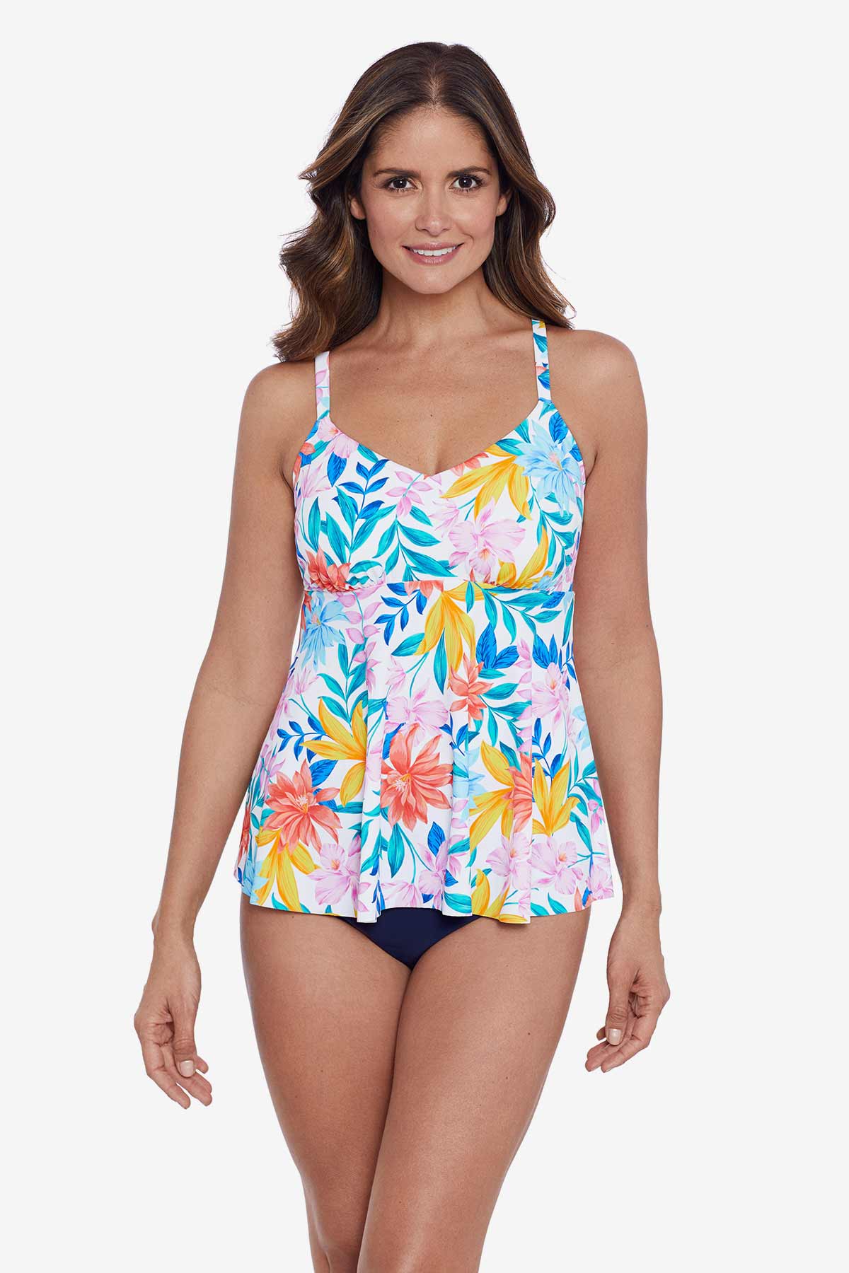 Woman wearing a multicolored tropical print tankini top