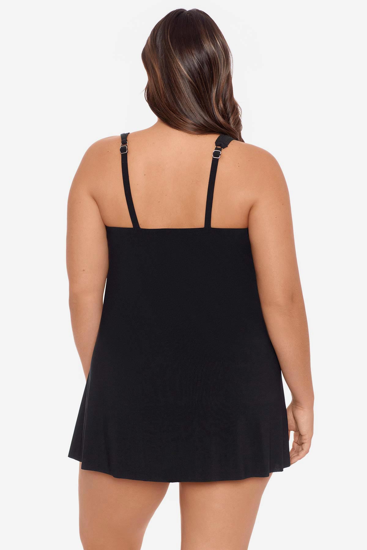 Woman turned away wearing a black swim dress with different straps