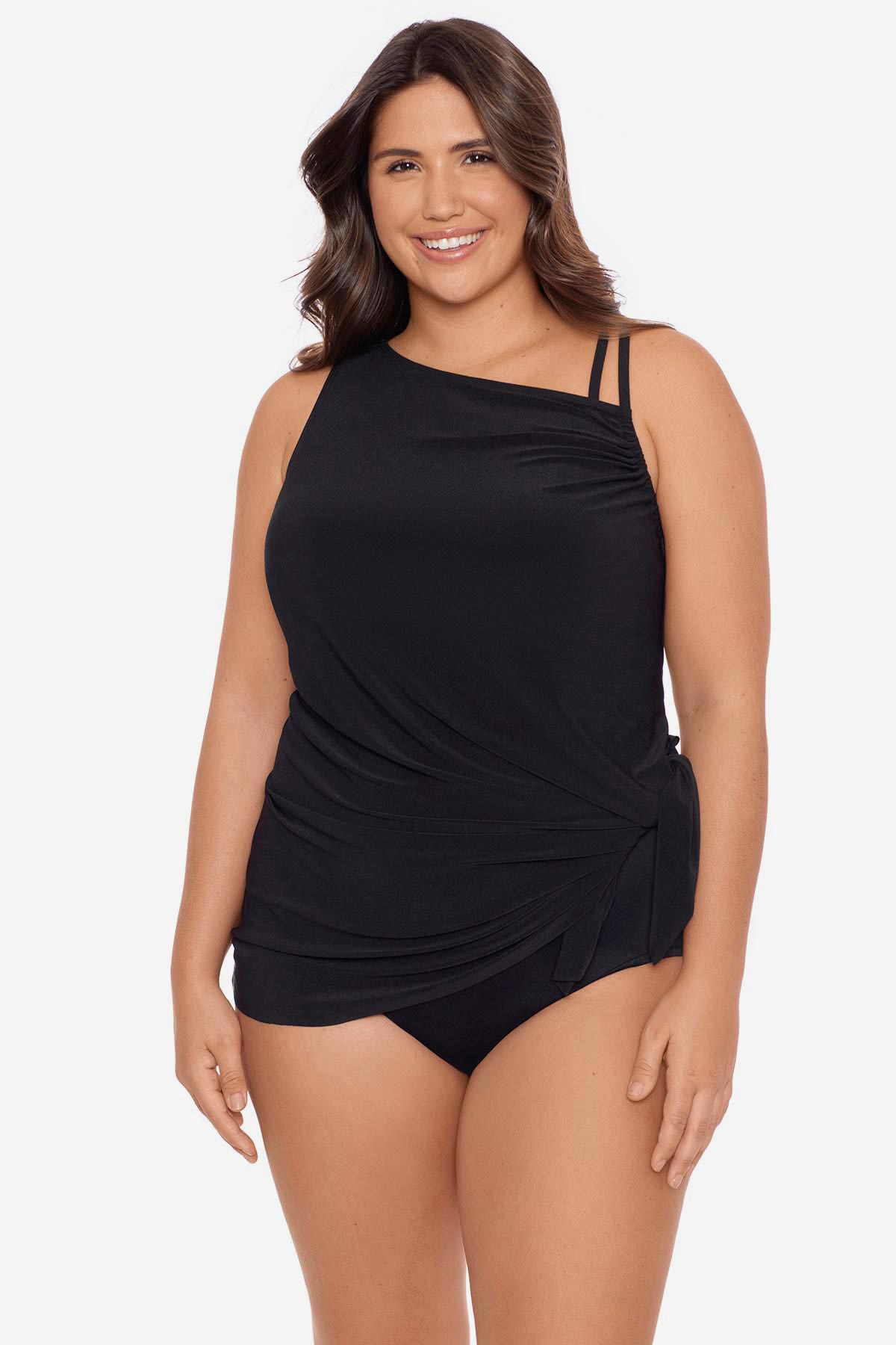 Woman wearing a black swim dress with different straps