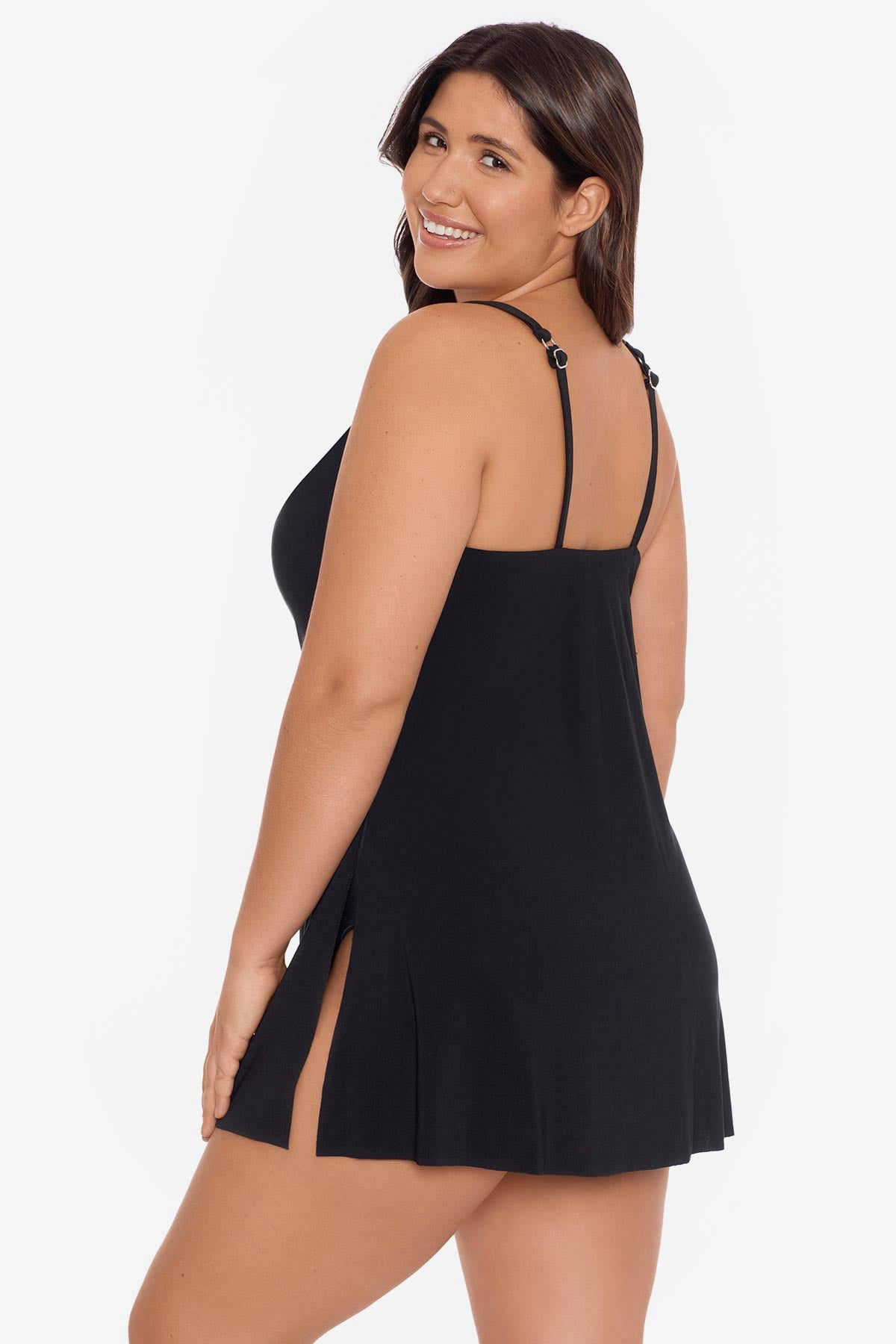 Woman turned left wearing a black swim dress with different straps
