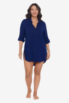 Woman wearing a navy-blue shirt dress swim cover up