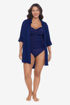 Woman wearing a navy-blue shirt dress swim cover up
