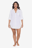 Woman wearing a white shirt dress swim cover up