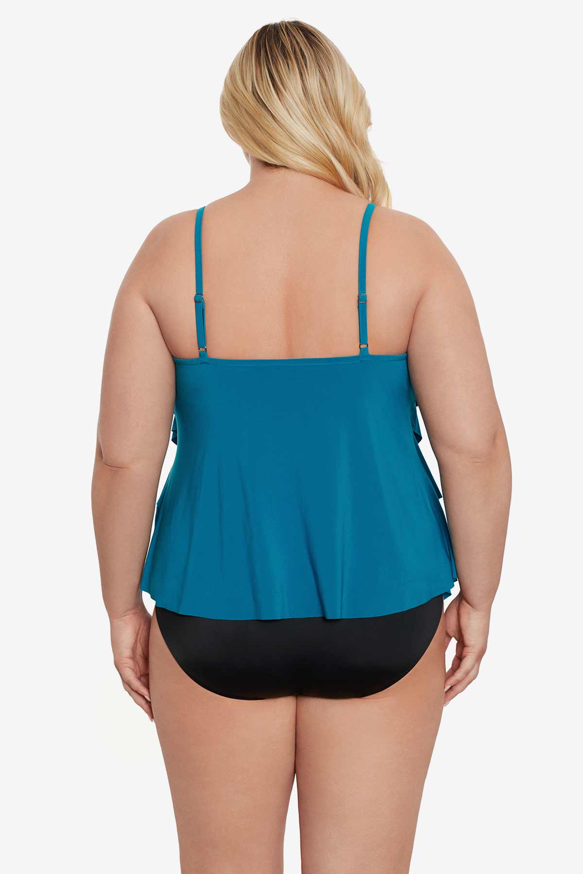 Woman faced away wearing a blue tankini top with ruffles