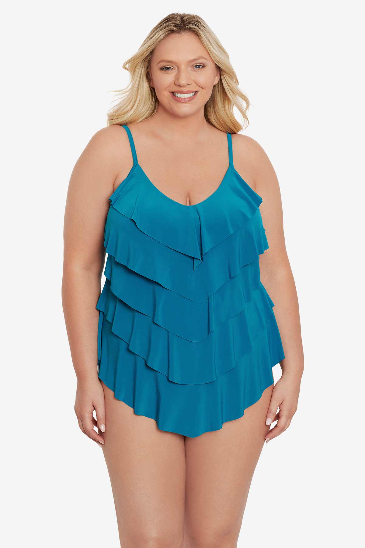 Woman wearing a blue tankini top with ruffles