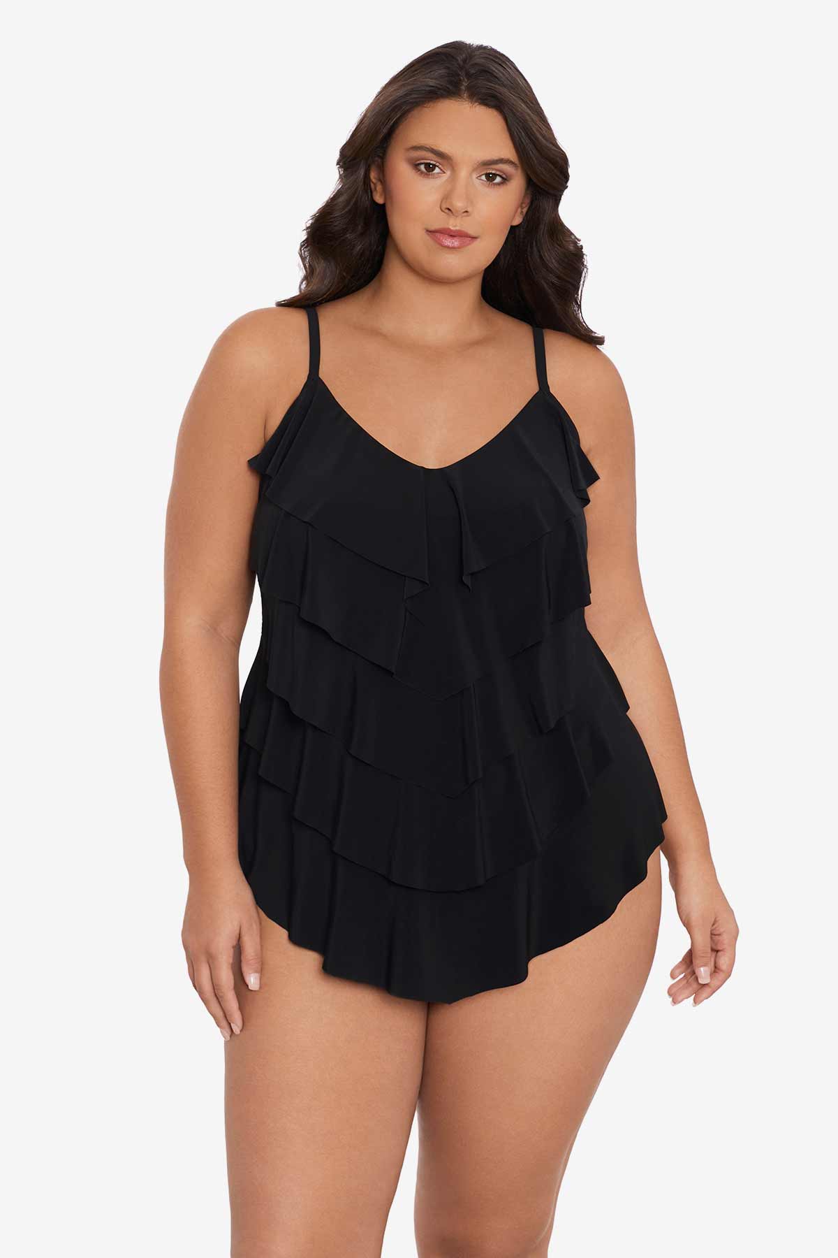 Woman wearing a black tankini top with ruffles