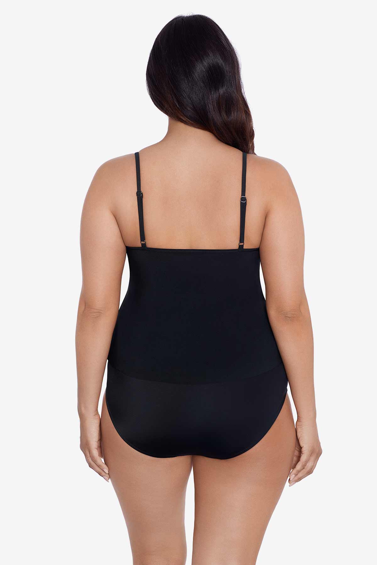 Woman faced away wearing a black tankini top with ruffles
