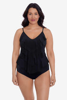 Woman wearing a black tankini top with ruffles