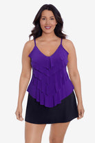 Woman wearing a purple tankini top with ruffles
