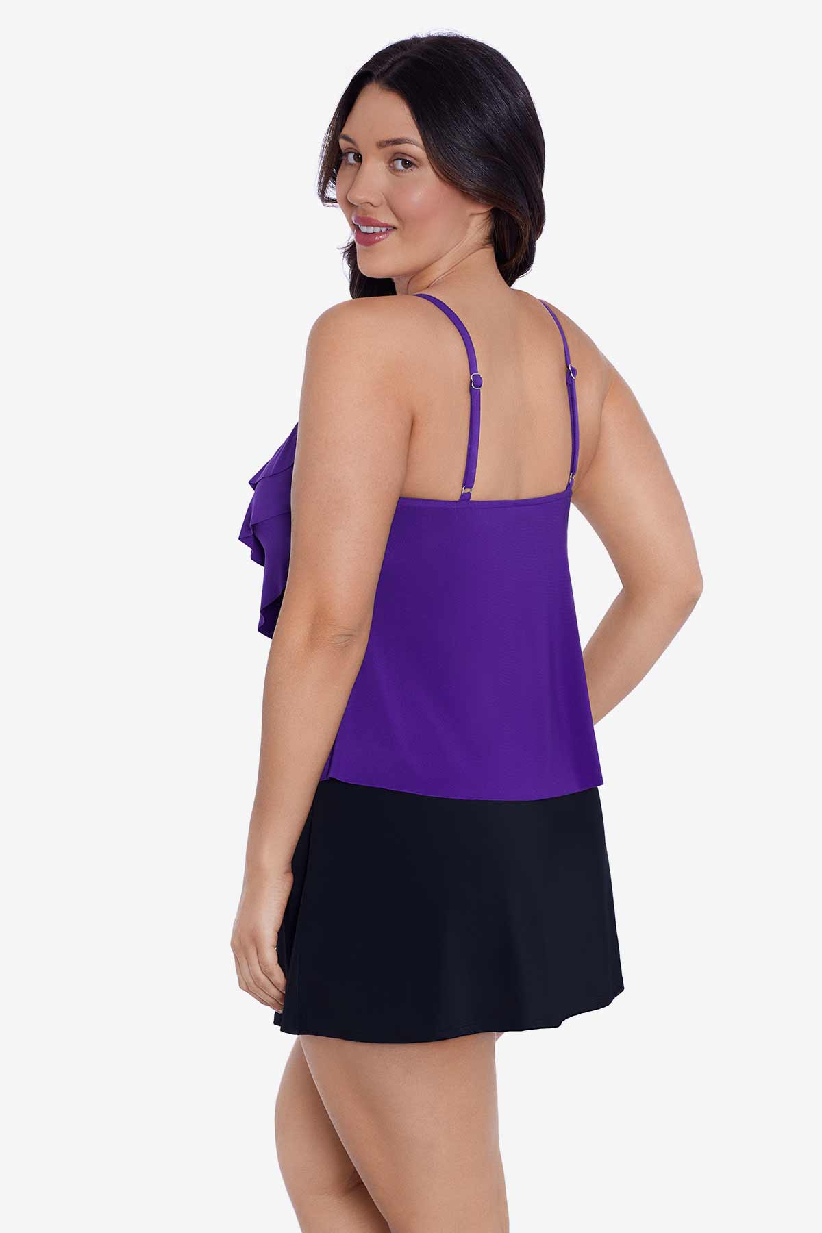 Woman turned left wearing a purple tankini top with ruffles