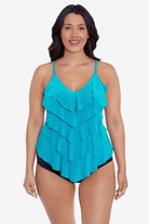 Woman wearing a light blue tankini top with ruffles