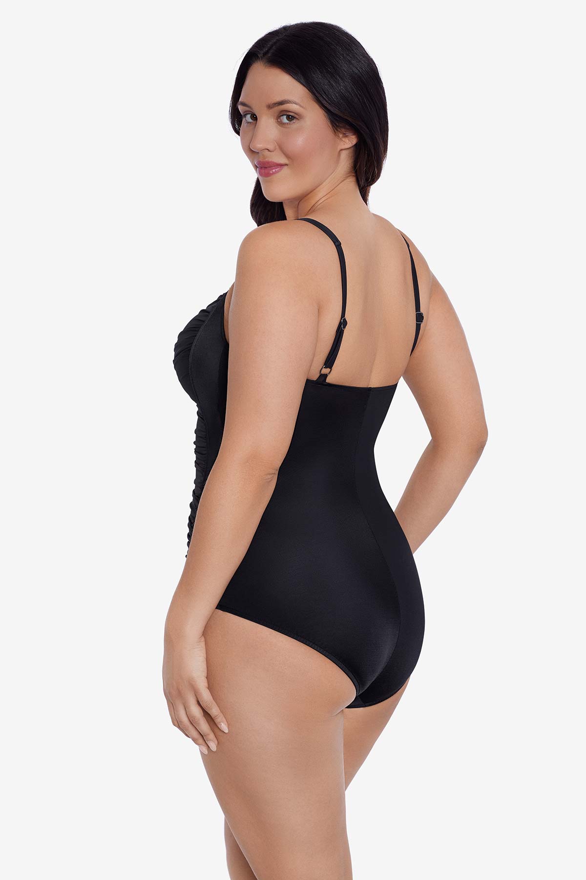 Woman faced left wearing a black one-piece swimsuit 