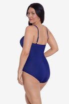 Woman turned left wearing a navy-blue one-piece swimsuit