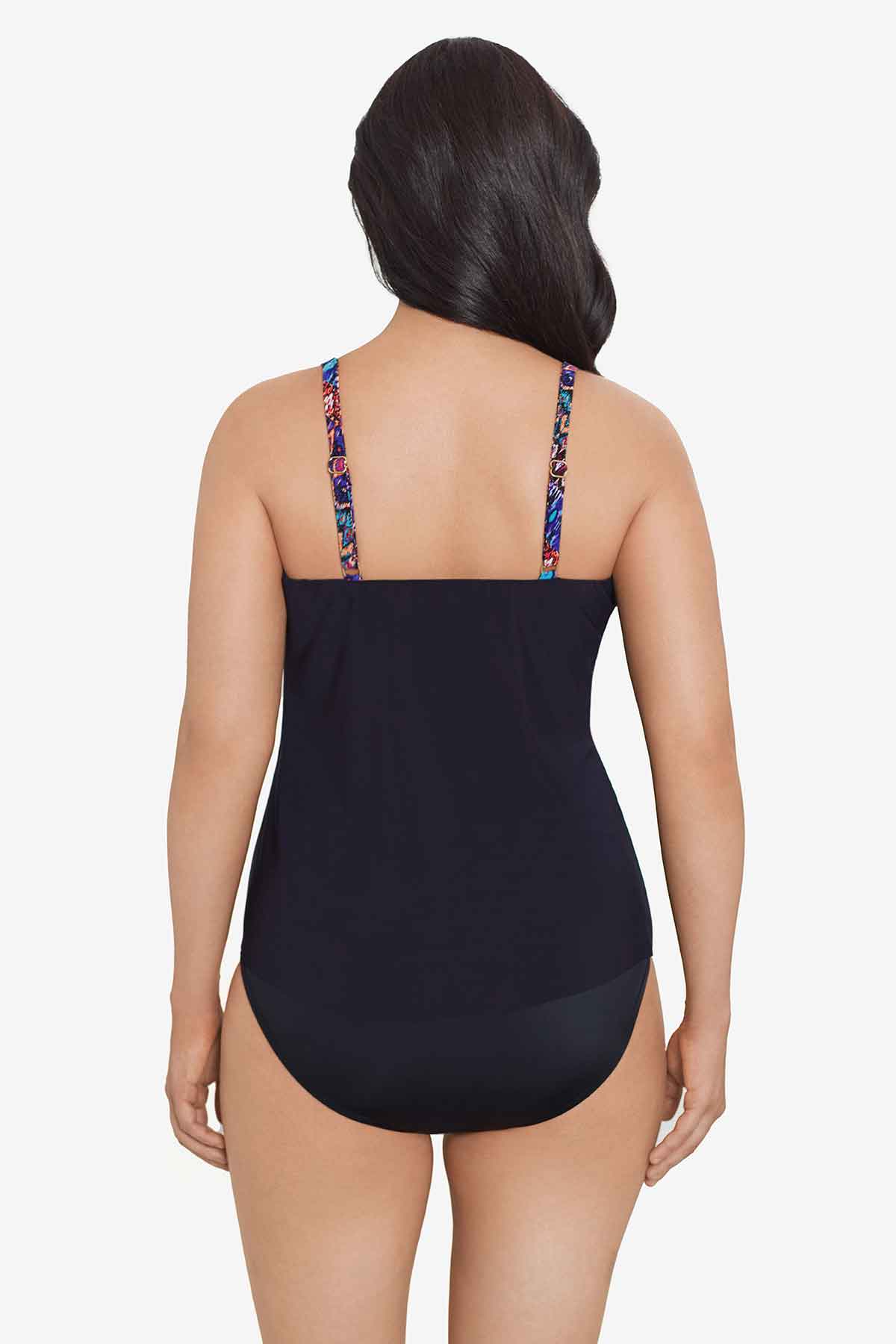 Woman faced away wearing a multicolored tile printed tankini top