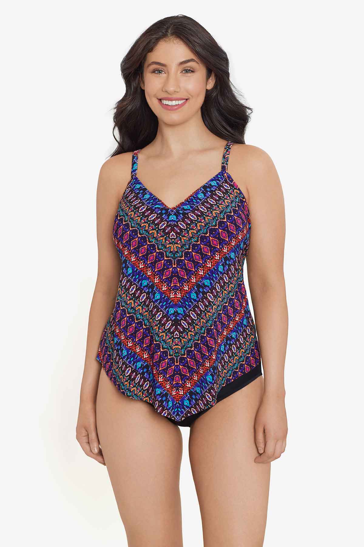 Woman wearing a multicolored tile printed tankini top