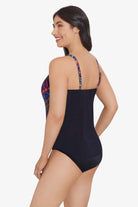 Woman faced left wearing a multicolored tile printed tankini top