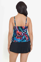 Woman faced away wearing a multicolored feather pattern swim romper