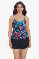 Woman wearing a multicolored feather pattern swim romper