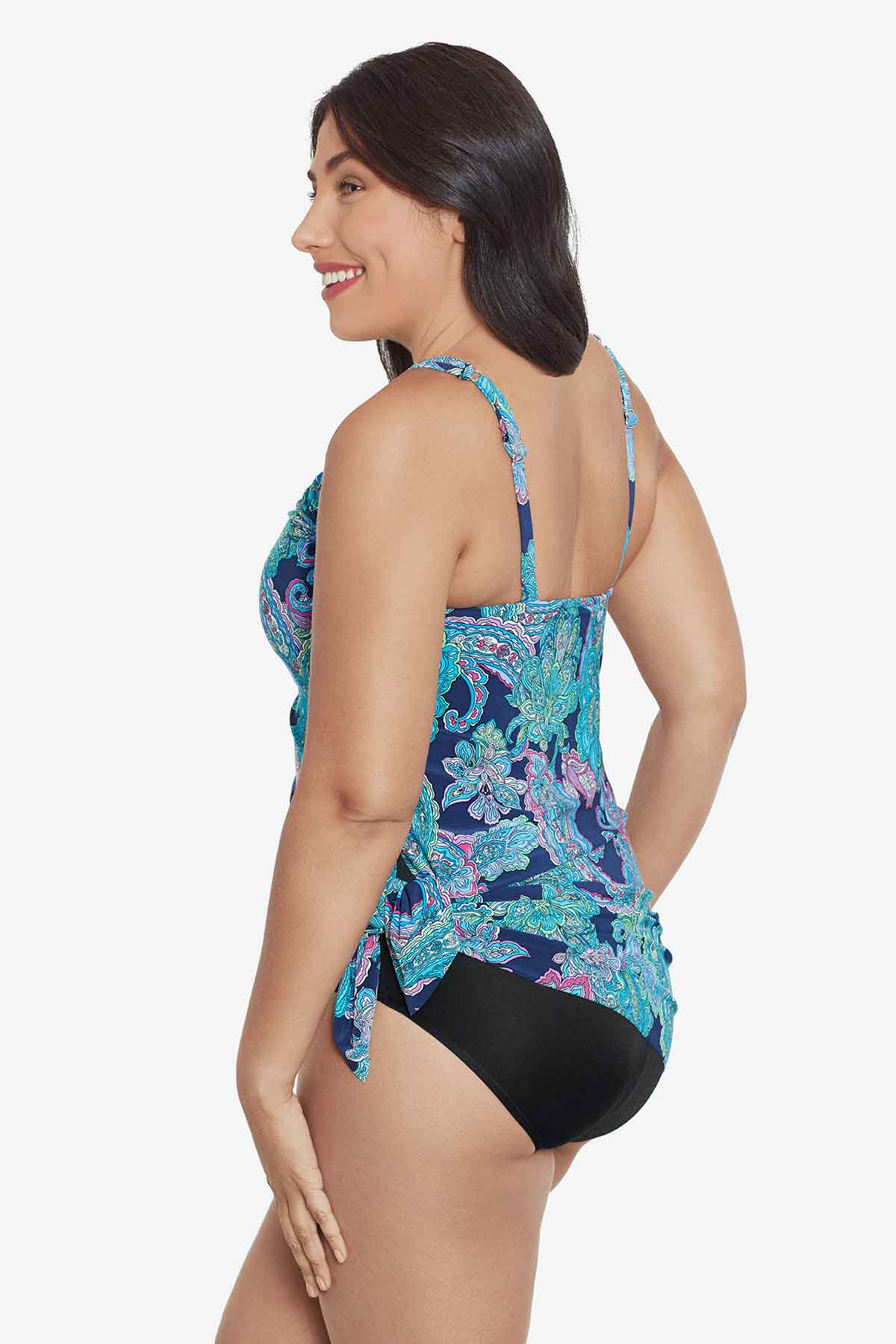 Woman turned left wearing a paisley printed swim dress 