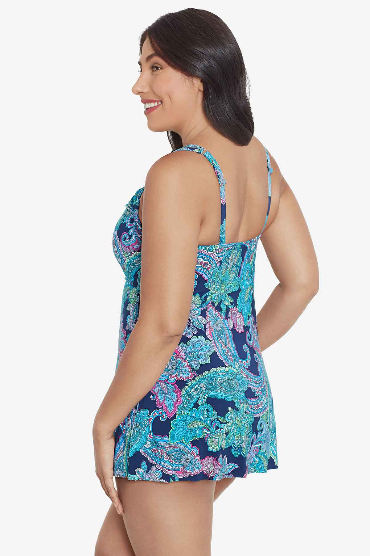 Woman turned left wearing a paisley printed swim dress 