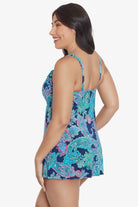 Woman turned left wearing a paisley printed swim dress 