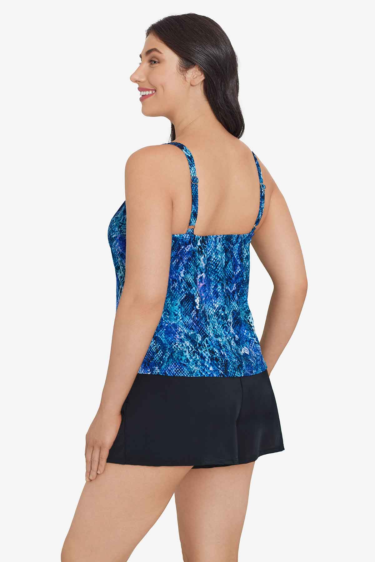 Woman turned left wearing a blue abstract printed swim romper