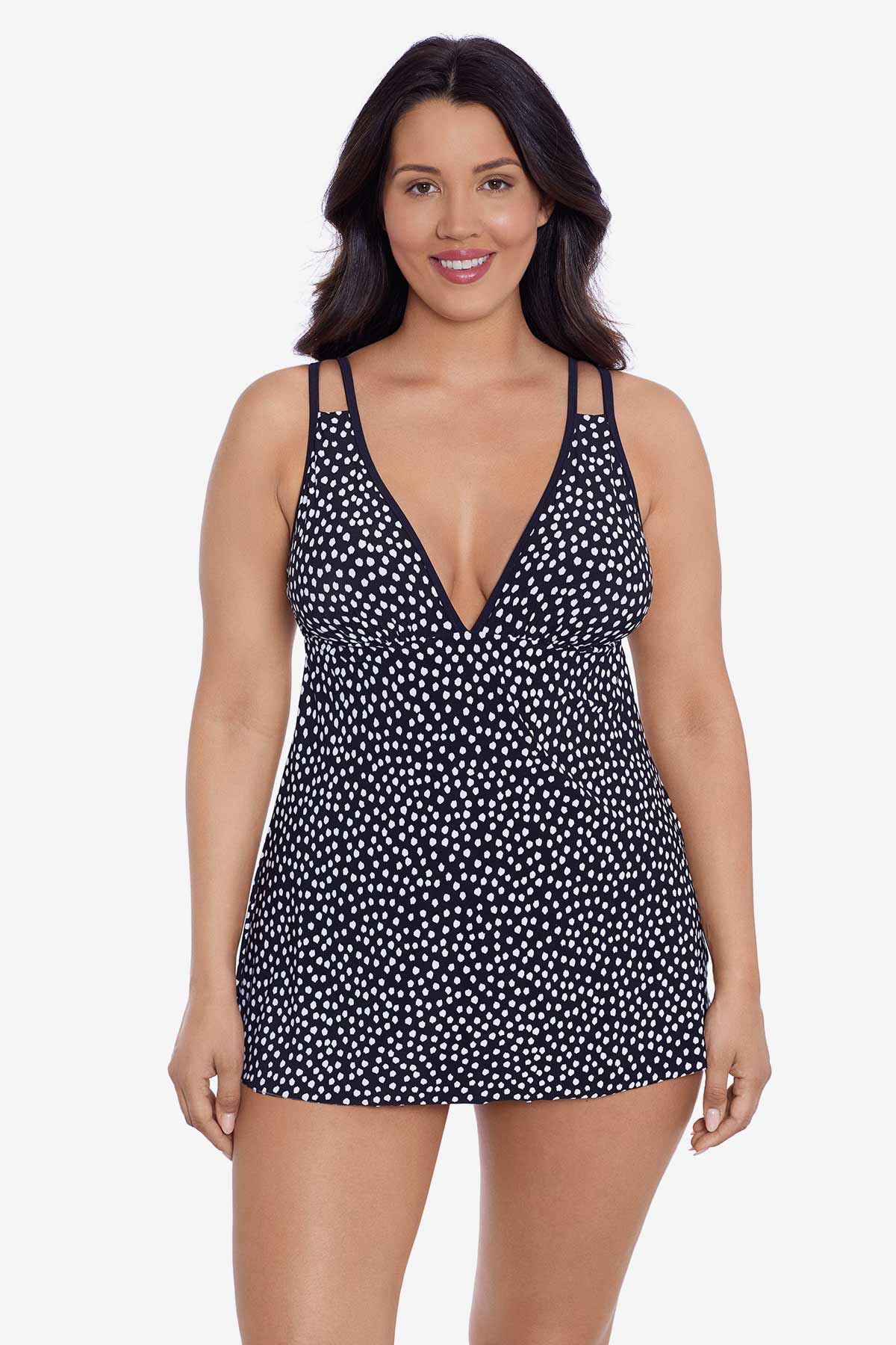 Woman wearing a black and white polka dot swim dress