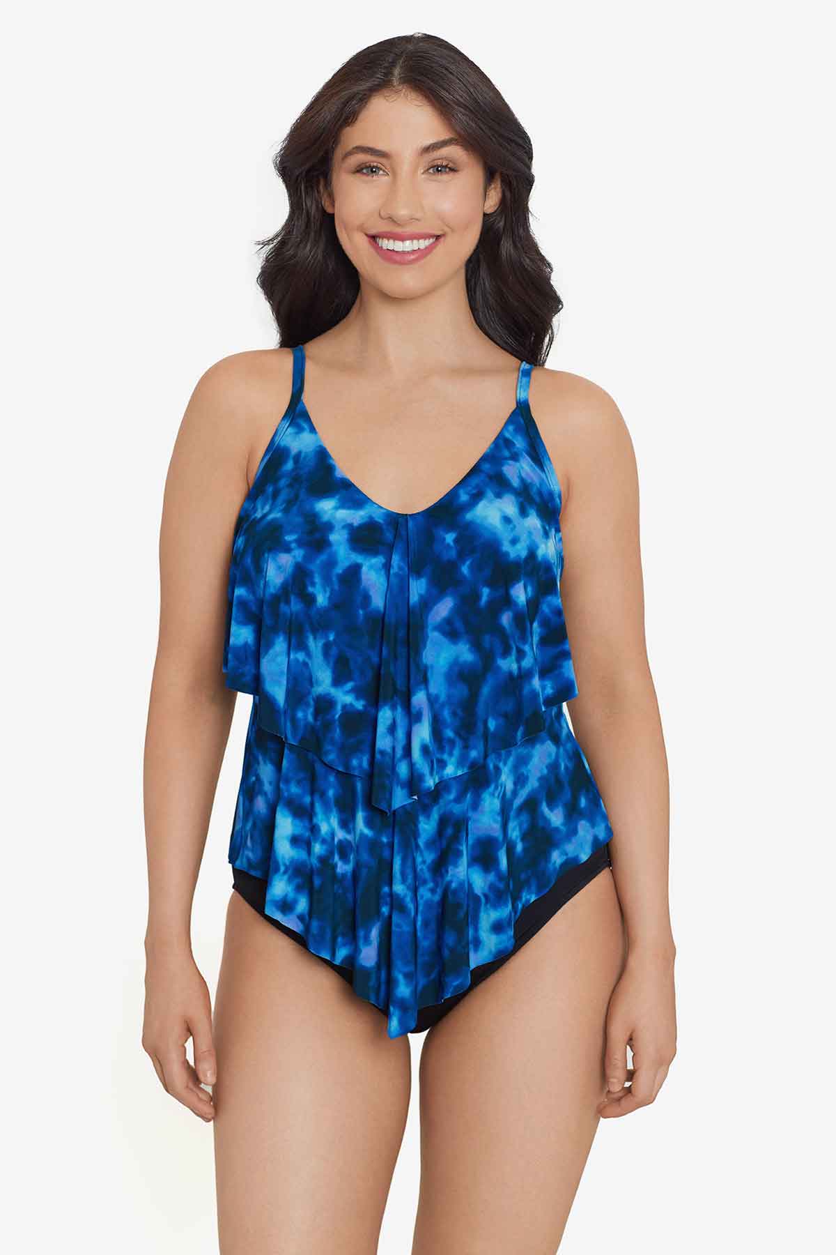 Woman wearing a blue tie dye ruffle tankini top