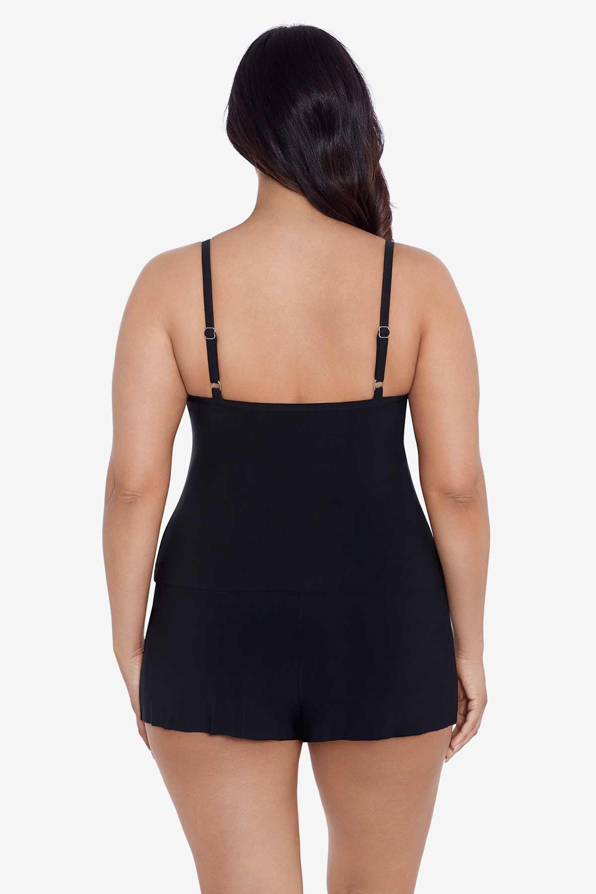 Woman faced away wearing a black swim romper