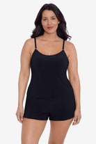 Woman wearing a black swim romper