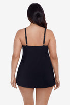 Woman faced away wearing a black ruffle swim dress