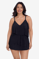 Woman wearing a black ruffle swim dress