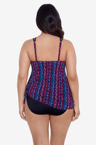Woman faced away wearing a purple and blue stripey pattern swim dress tied at the side