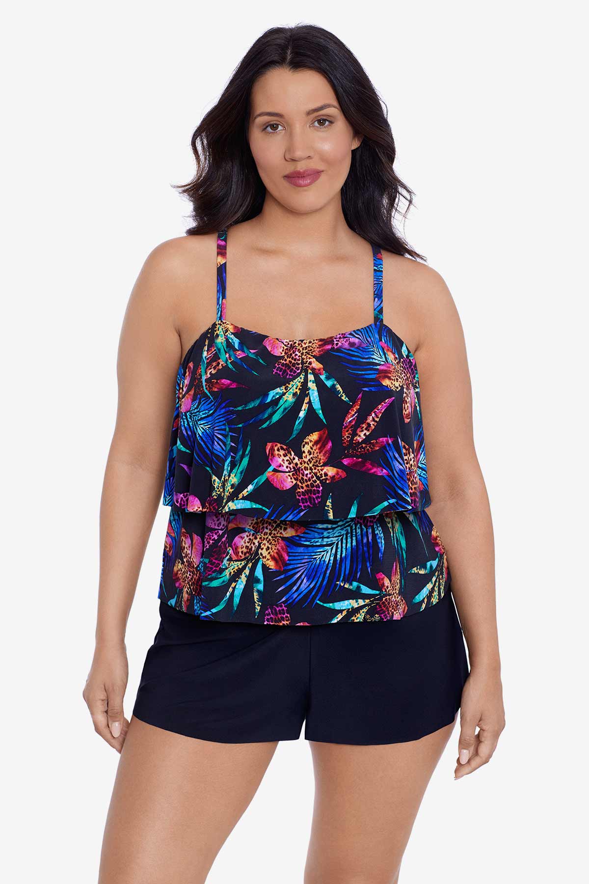 Woman wearing a multicolored tropical printed swim romper