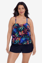 Woman wearing a multicolored tropical printed swim romper