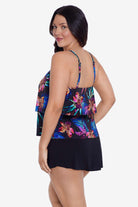 Woman turned left wearing a multicolored tropical printed swim romper