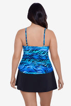 Woman faced away wearing a blue wave printed tankini top
