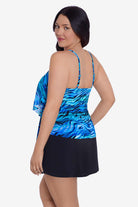 Woman faced left wearing a blue wave printed tankini top