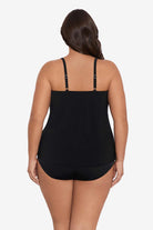 Woman turned away wearing a black tankini top 