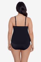 Woman turned away wearing a black tankini top 