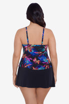 Woman faced away wearing a multicolored tropical pattern tiered tankini top