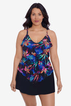 Woman wearing a multicolored tropical pattern tiered tankini top