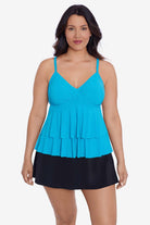Woman wearing a light blue tiered tankini top