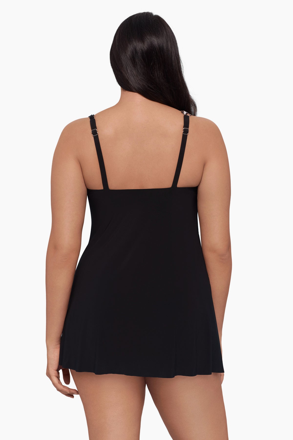 Woman turned away wearing a swim dress 